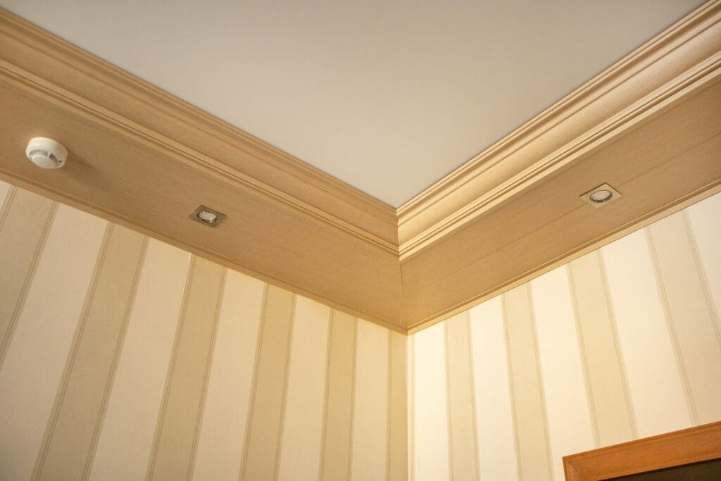 Part Of The Living Room, Corner Of The Wall From The Ceiling, Mounted LED Lights In A Wooden Console On The Ceiling
