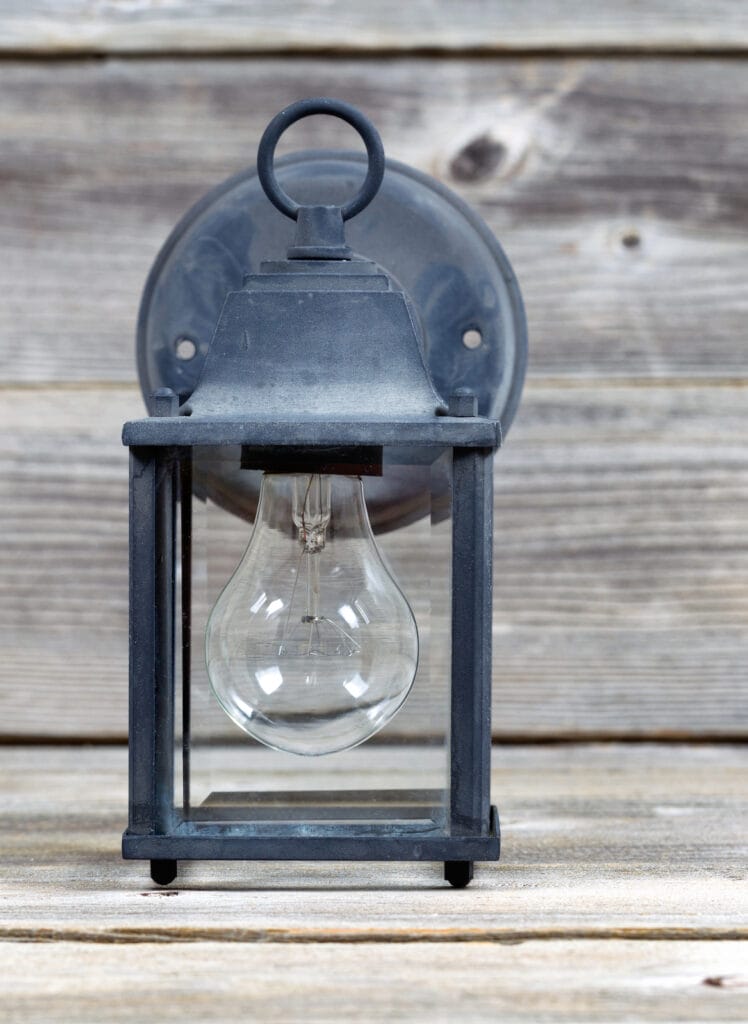 Vintage Outdoor Light On Weathered Wood 